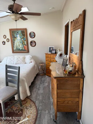a living room with furniture and a mirror