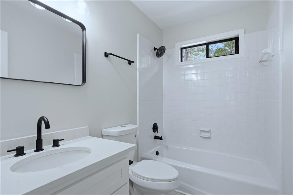 2800 Lakewind Court Alpharetta, GA 30005 - Photo 13 of 26 a bathroom with a sink toilet and shower