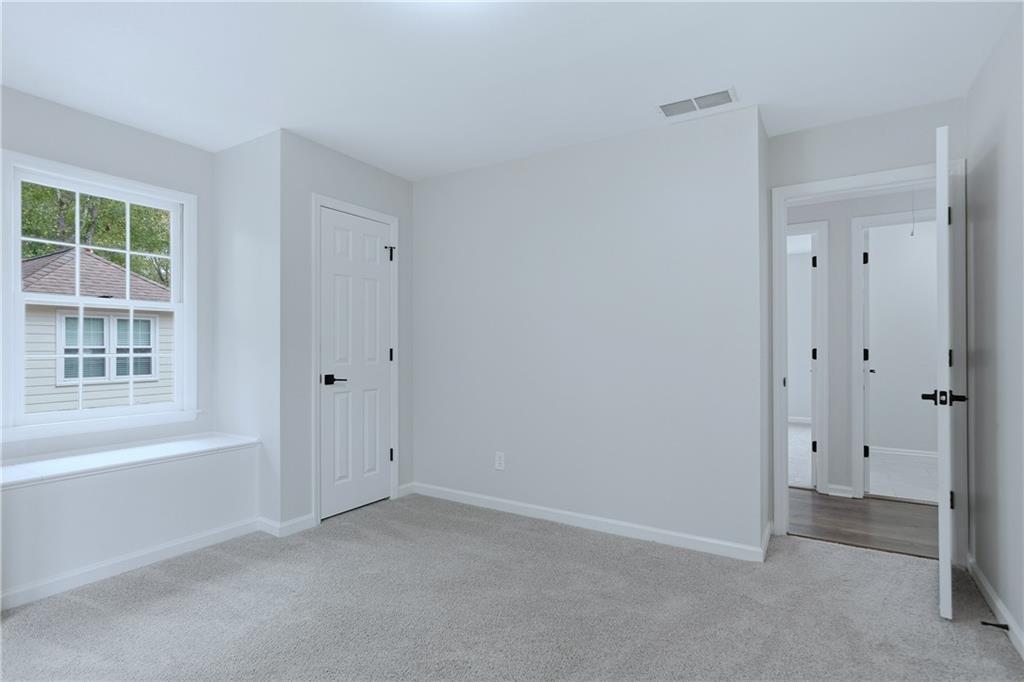 2800 Lakewind Court Alpharetta, GA 30005 - Photo 14 of 26 a view of an empty room with a window