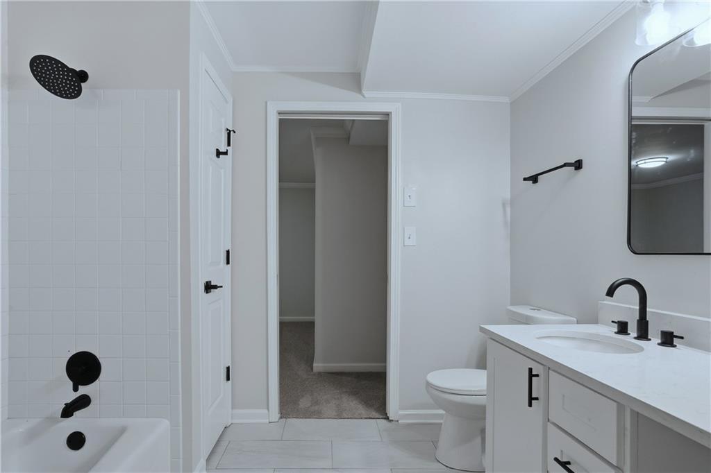 2800 Lakewind Court Alpharetta, GA 30005 - Photo 22 of 26 a bathroom with a granite countertop sink a toilet and a mirror
