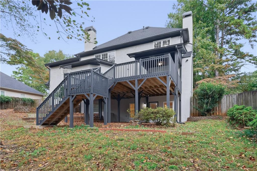 2800 Lakewind Court Alpharetta, GA 30005 - Photo 26 of 26 a front view of a house with garden