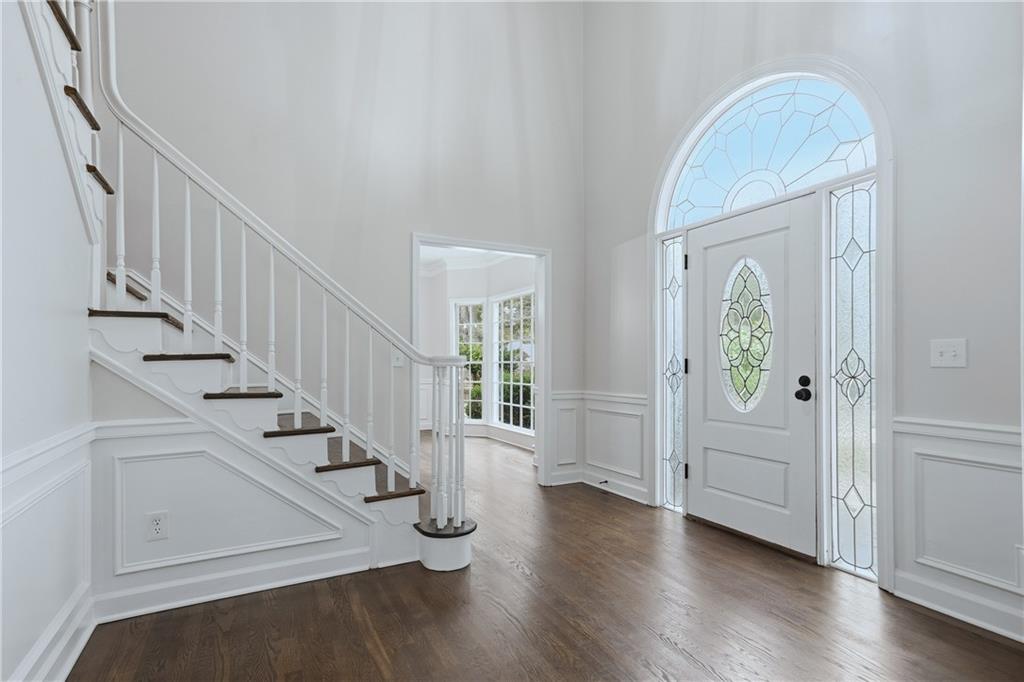 2800 Lakewind Court Alpharetta, GA 30005 - Photo 3 of 26 a view of entryway with wooden floor and stairs