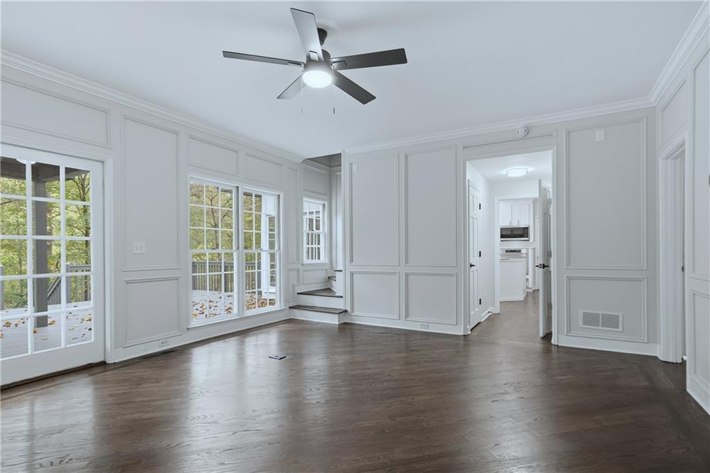 2800 Lakewind Court Alpharetta, GA 30005 - Photo 6 of 26 a view of an empty room with wooden floor and a window