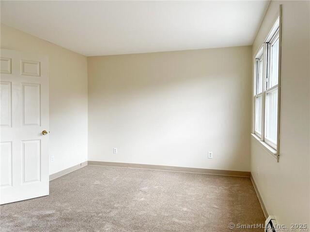 77 Marion Avenue, Unit 2 Torrington, CT 06790 - Photo 18 of 35 a view of an empty room and a window
