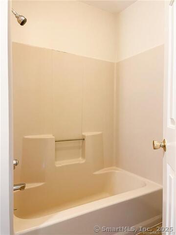 77 Marion Avenue, Unit 2 Torrington, CT 06790 - Photo 22 of 35 a bathroom with a bathtub
