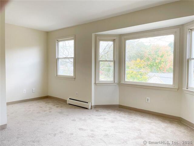 77 Marion Avenue, Unit 2 Torrington, CT 06790 - Photo 25 of 35 an empty room with windows