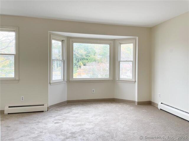 77 Marion Avenue, Unit 2 Torrington, CT 06790 - Photo 26 of 35 an empty room with windows