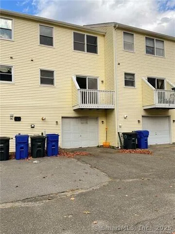 a front view of a building with many windows