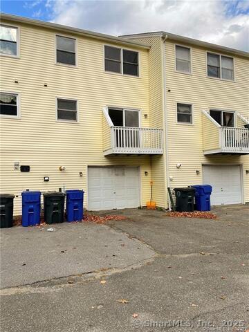 77 Marion Avenue, Unit 2 Torrington, CT 06790 - Photo 27 of 35 a front view of a building with many windows