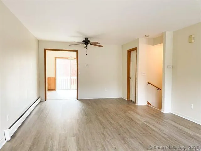 wooden floor in an empty room with a window