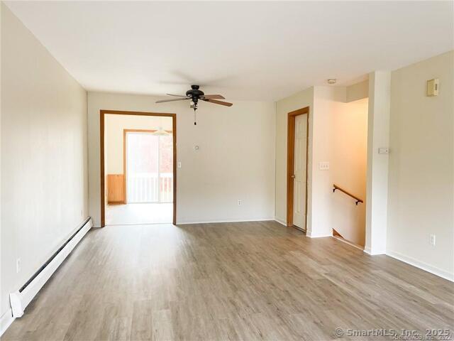 77 Marion Avenue, Unit 2 Torrington, CT 06790 - Photo 8 of 35 wooden floor in an empty room with a window