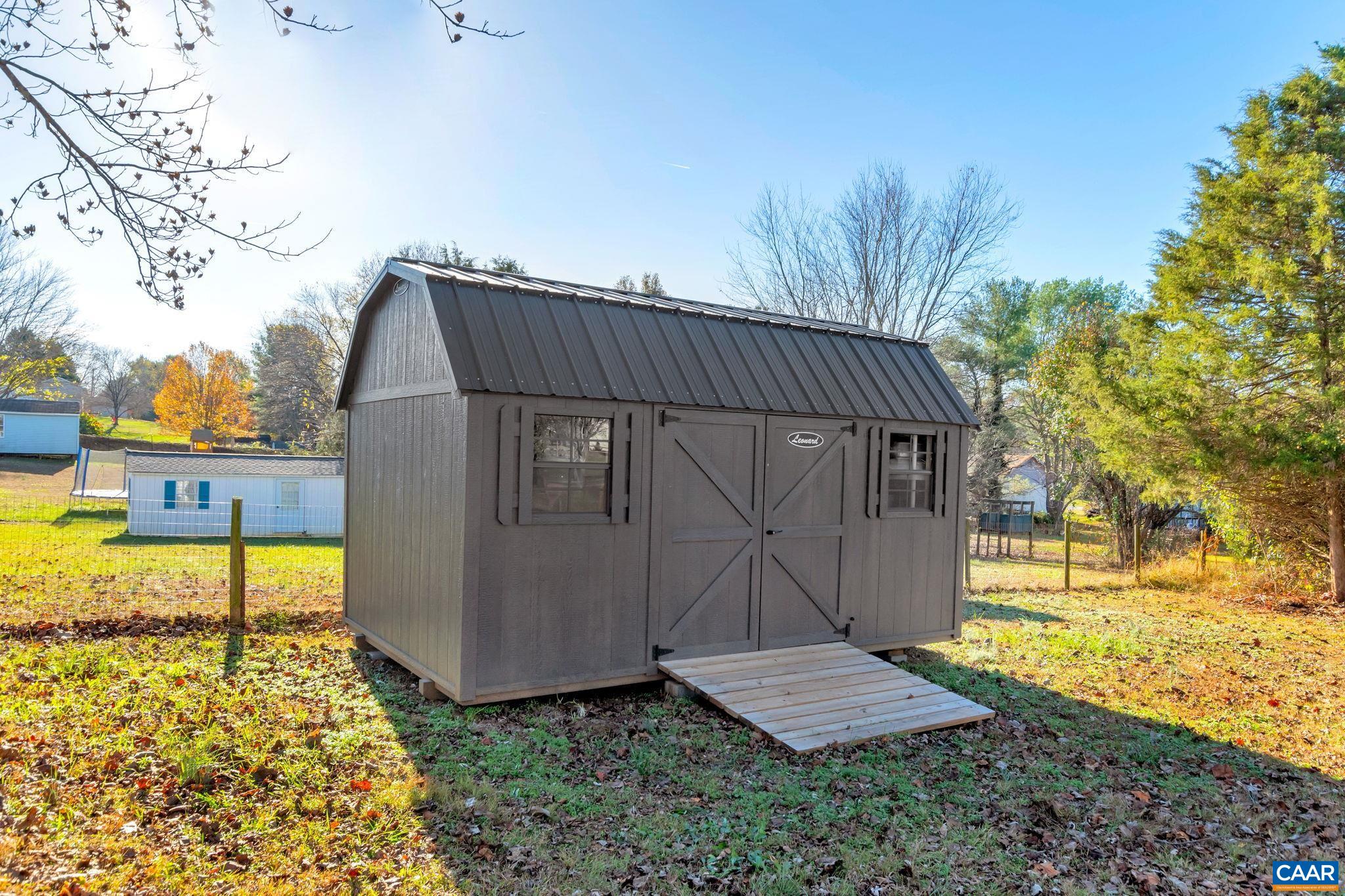 1017 Cedar Grove Road Ruckersville, VA 22968 - Photo 26 of 30 a view of a house with backyard and wooden fence