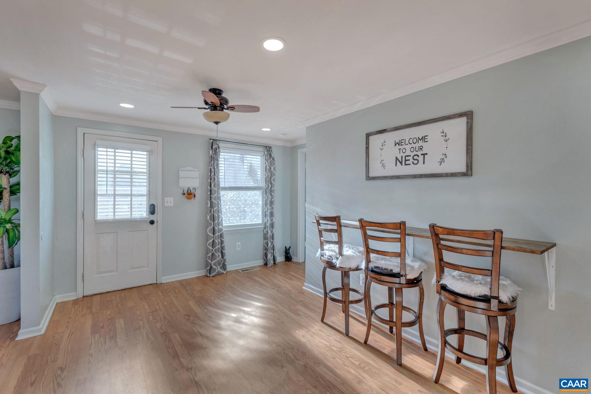 1017 Cedar Grove Road Ruckersville, VA 22968 - Photo 8 of 30 a view of a dining room with furniture and wooden floor
