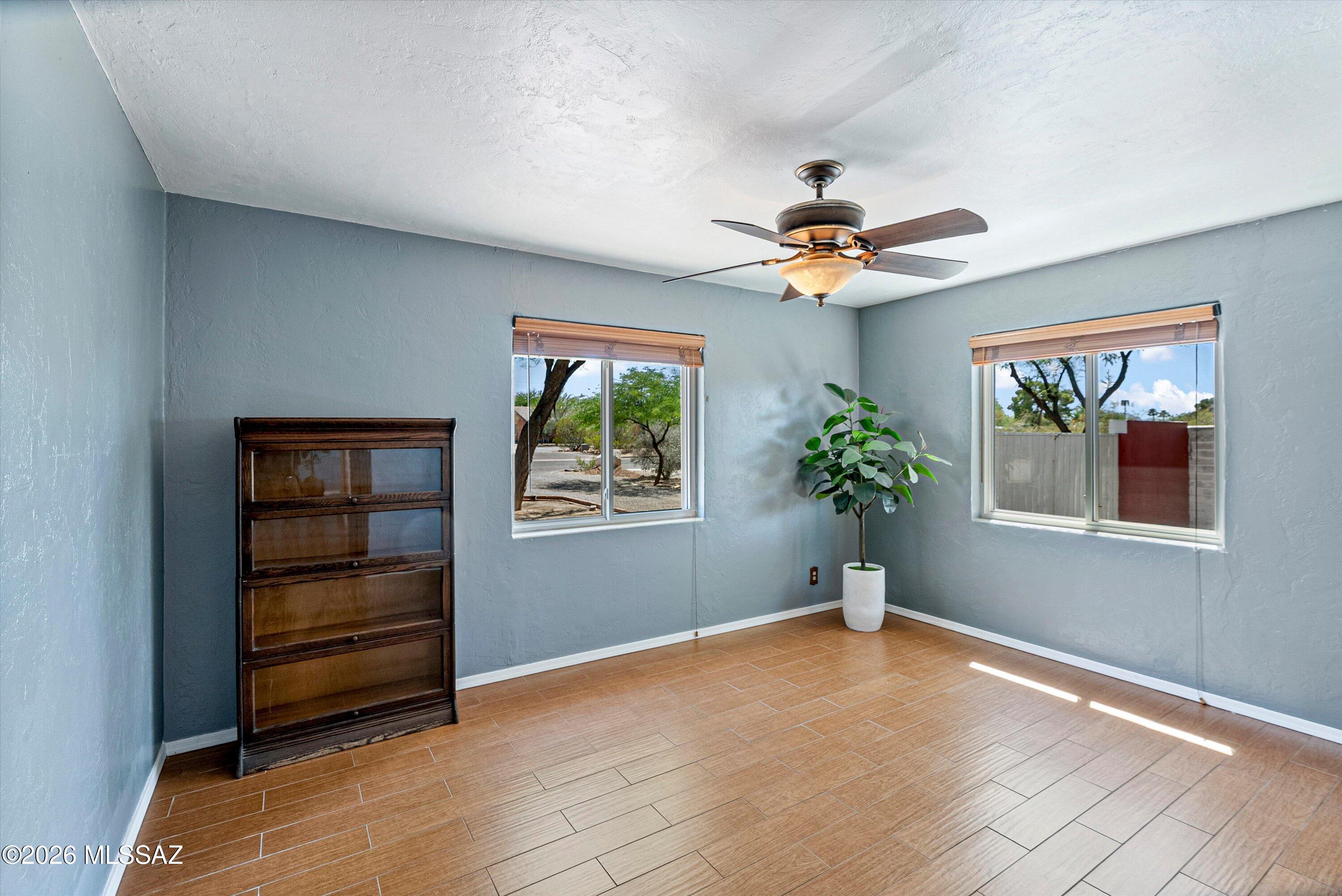 2107 East Lind Road Tucson, AZ 85719 - Photo 25 of 43 wooden floor in an empty room with a window