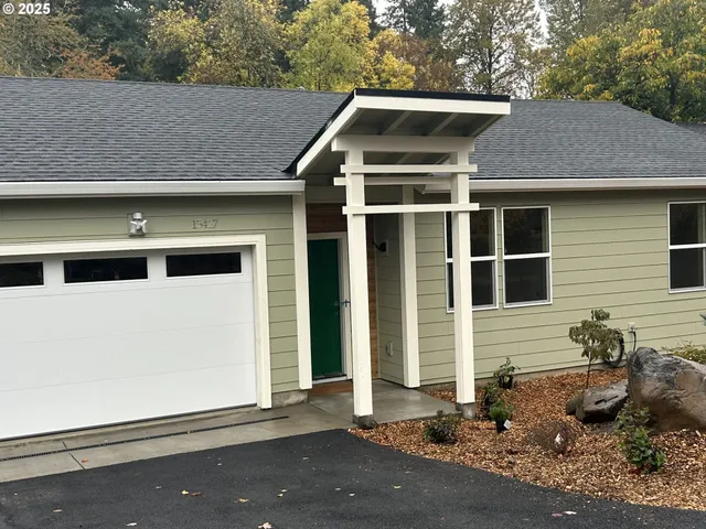 a front view of a house with a garage