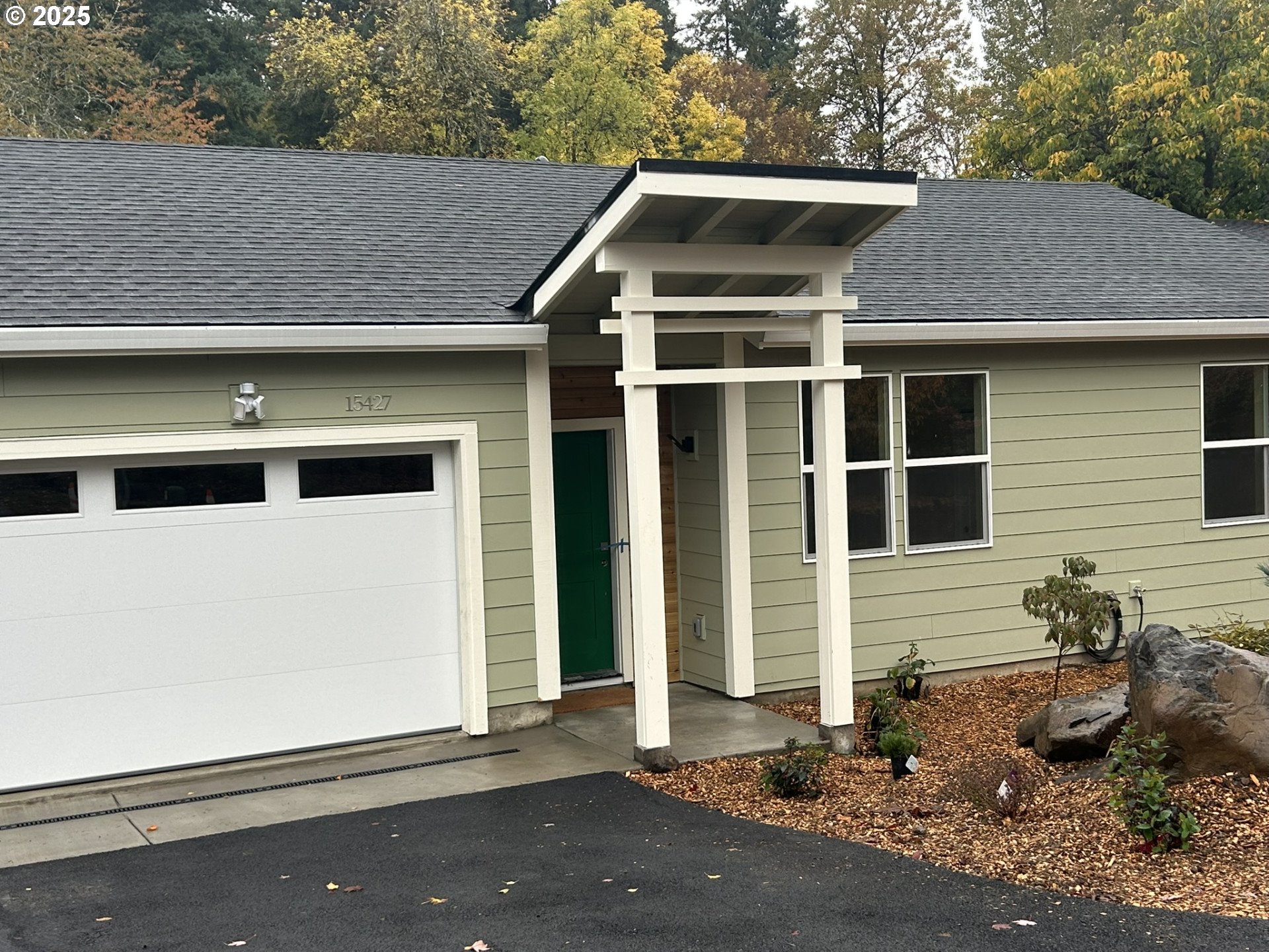 a front view of a house with a garage