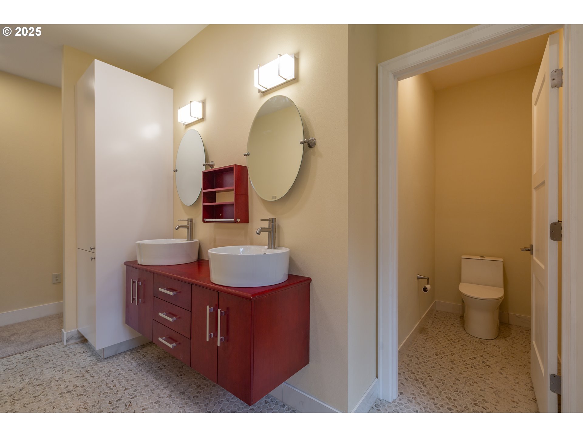 15427 Southeast River Road Oak Grove, OR 97267 - Photo 19 of 30 a bathroom with a toilet a sink and mirror