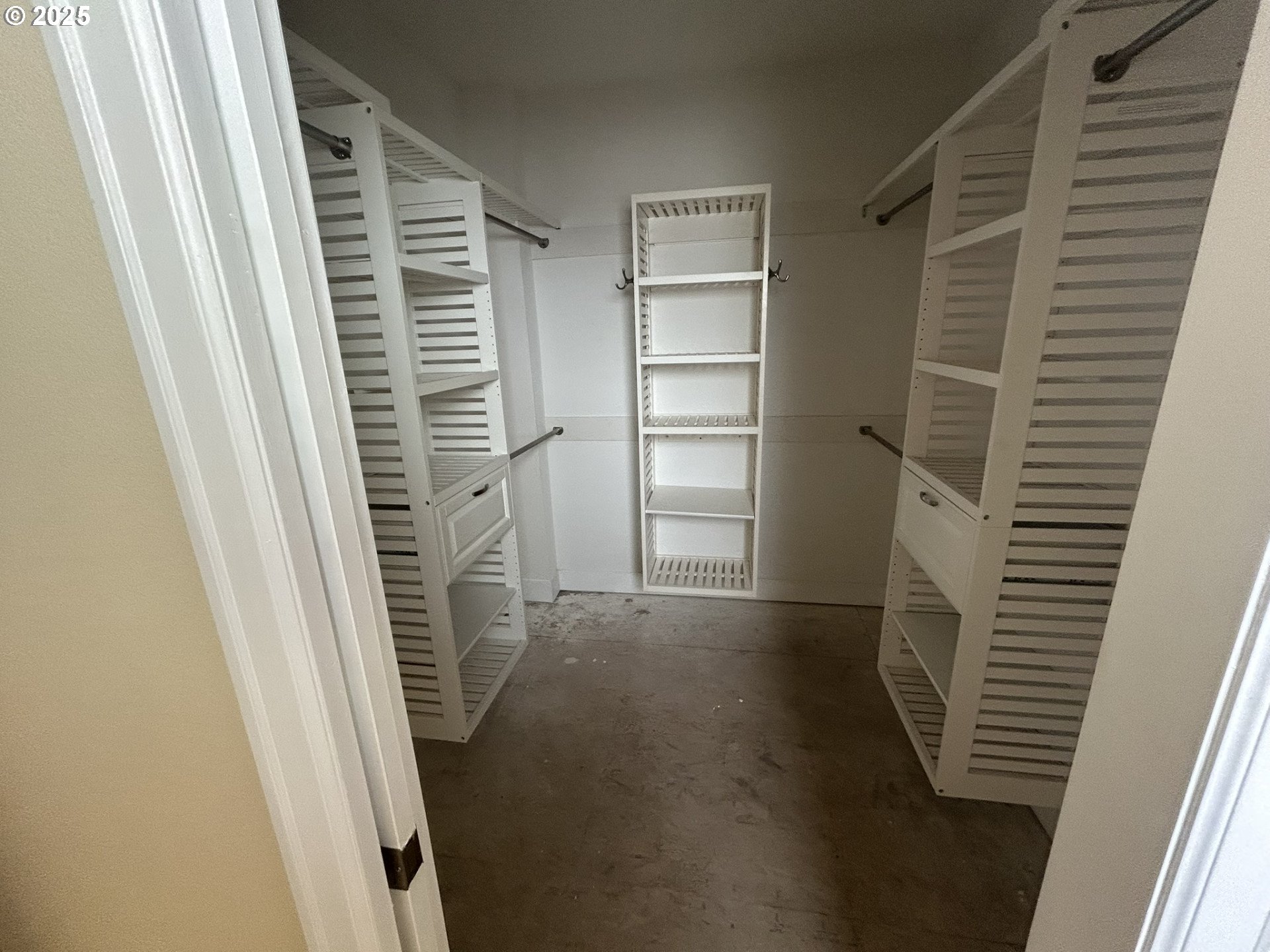 15427 Southeast River Road Oak Grove, OR 97267 - Photo 7 of 30 a view of walk in closet with empty racks