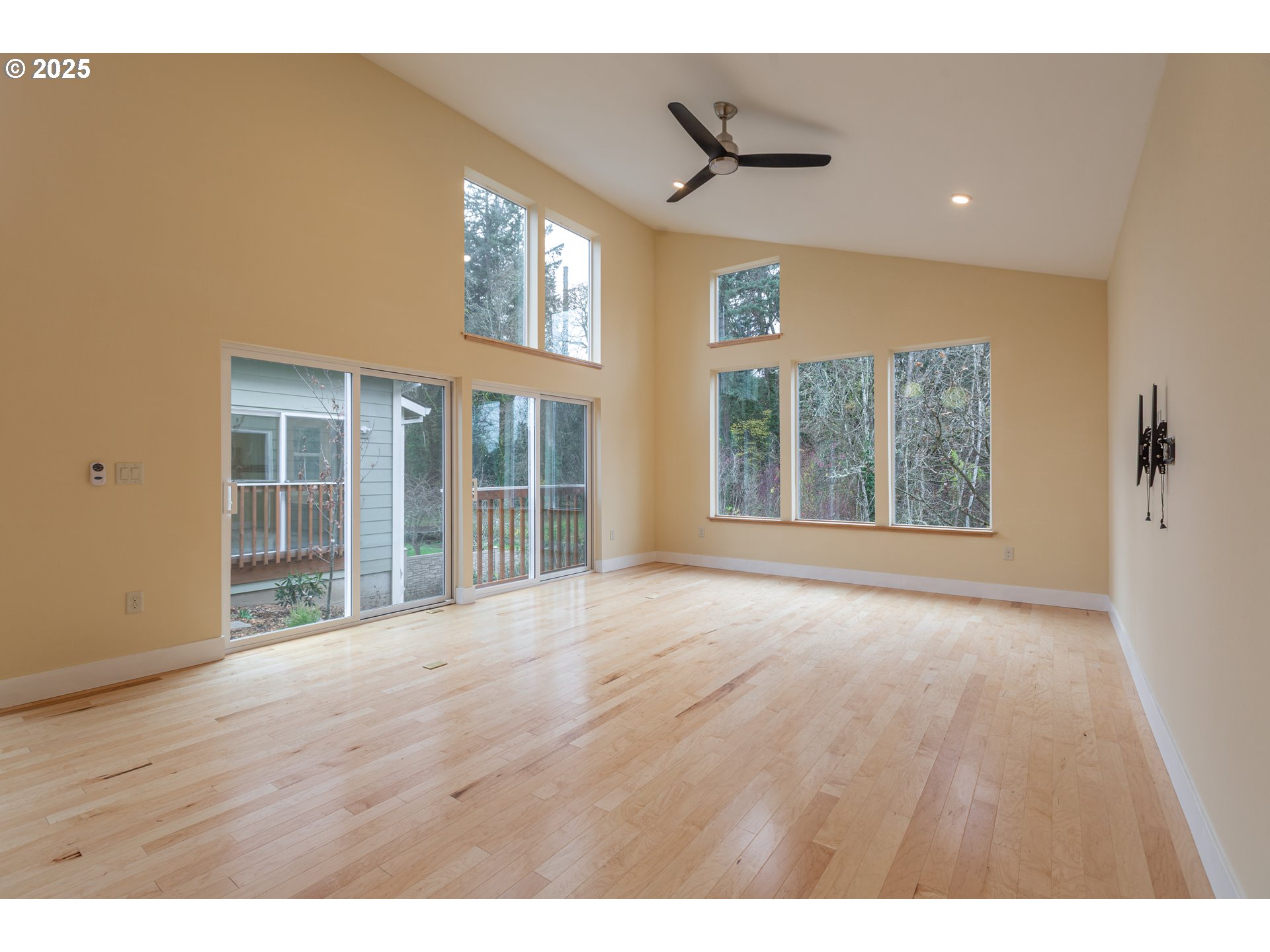 15427 Southeast River Road Oak Grove, OR 97267 - Photo 10 of 30 a view of an empty room with a window and wooden floor
