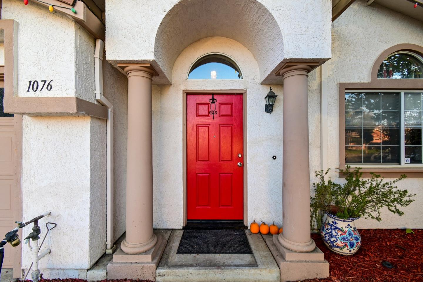 1076 Eagle Drive Salinas, CA 93905 - Photo 2 of 2 a view of front door of house with potted plant