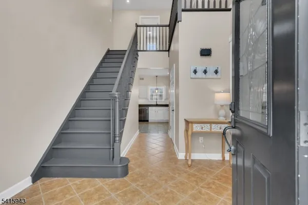 a view of staircase with white walls and windows