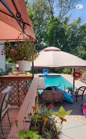a view of backyard with seating area and green space