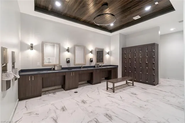 a kitchen with a sink and natural light