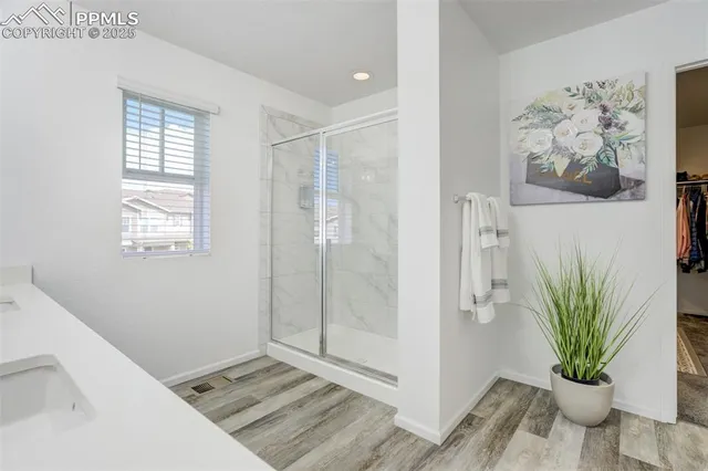 a view of entryway with window and wooden floor