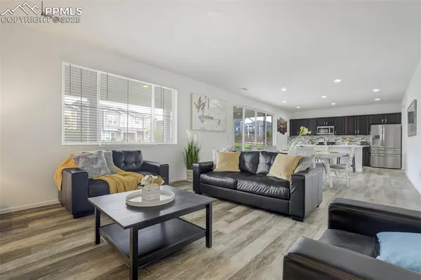 a living room with furniture and a table