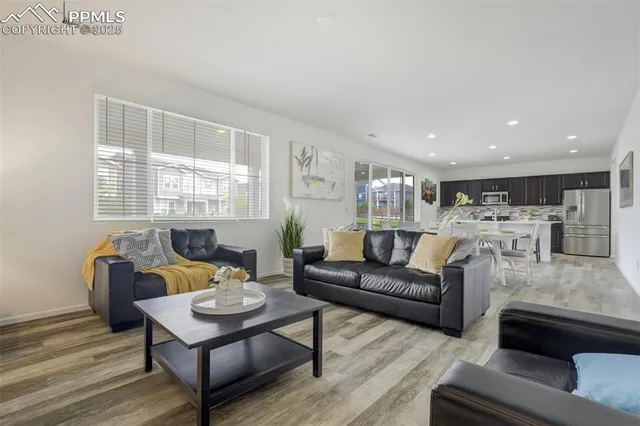 a living room with furniture and a table