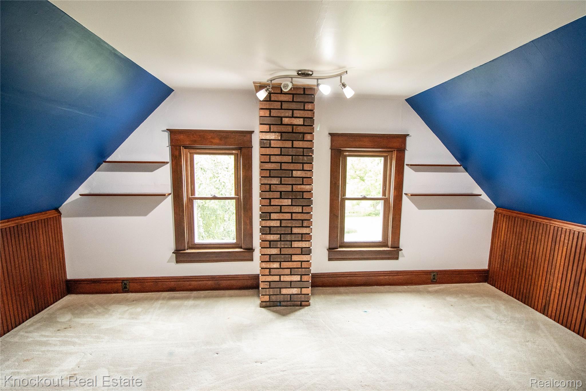 19983 West Ridge Road Henderson, MI 48841 - Photo 60 of 76 Bright attic space featuring two windows with dark wood trim