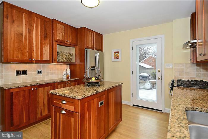 1911 Stratton Road Silver Spring, MD 20910 - Photo 5 of 12 Kitchen with island and exit to deck