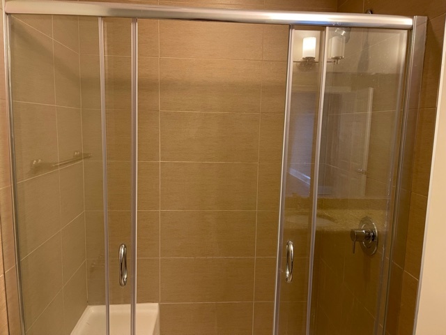 728 North Diamond Lake Road, Unit 205 Mundelein, IL 60060 - Photo 13 of 19 a bathroom with a shower