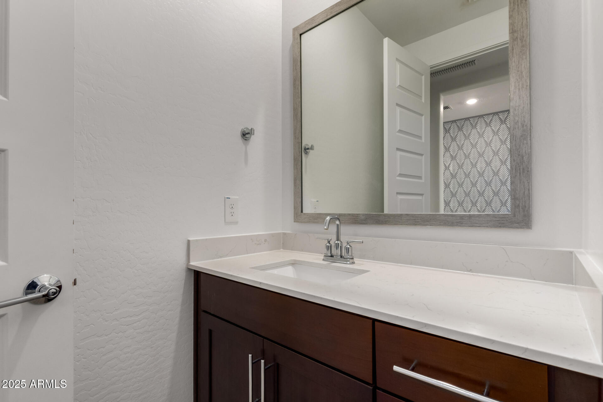 1156 East Weatherby Way Chandler, AZ 85286 - Photo 18 of 47 a bathroom with a sink and a mirror