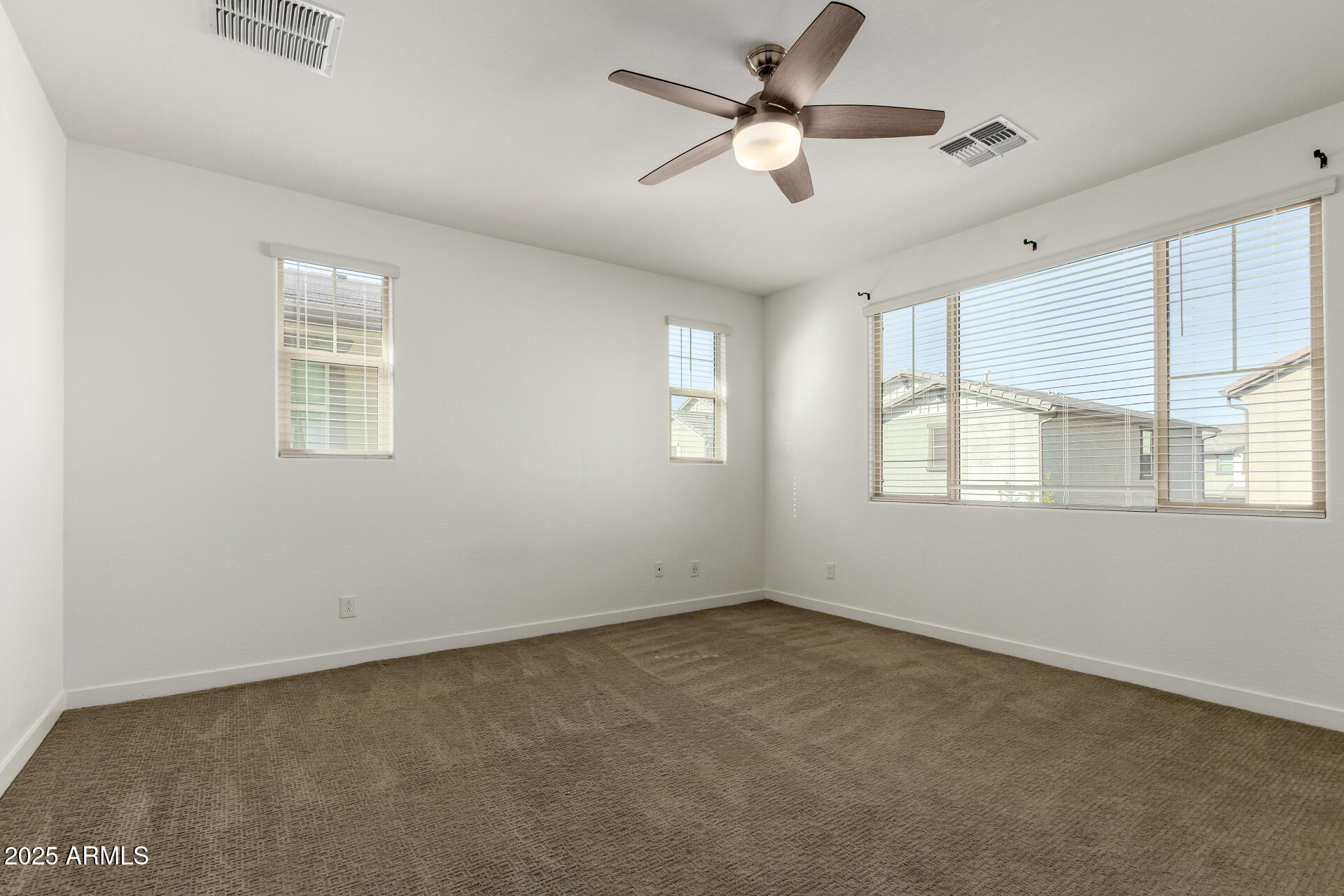 1156 East Weatherby Way Chandler, AZ 85286 - Photo 19 of 47 a view of room with a ceiling fan and window