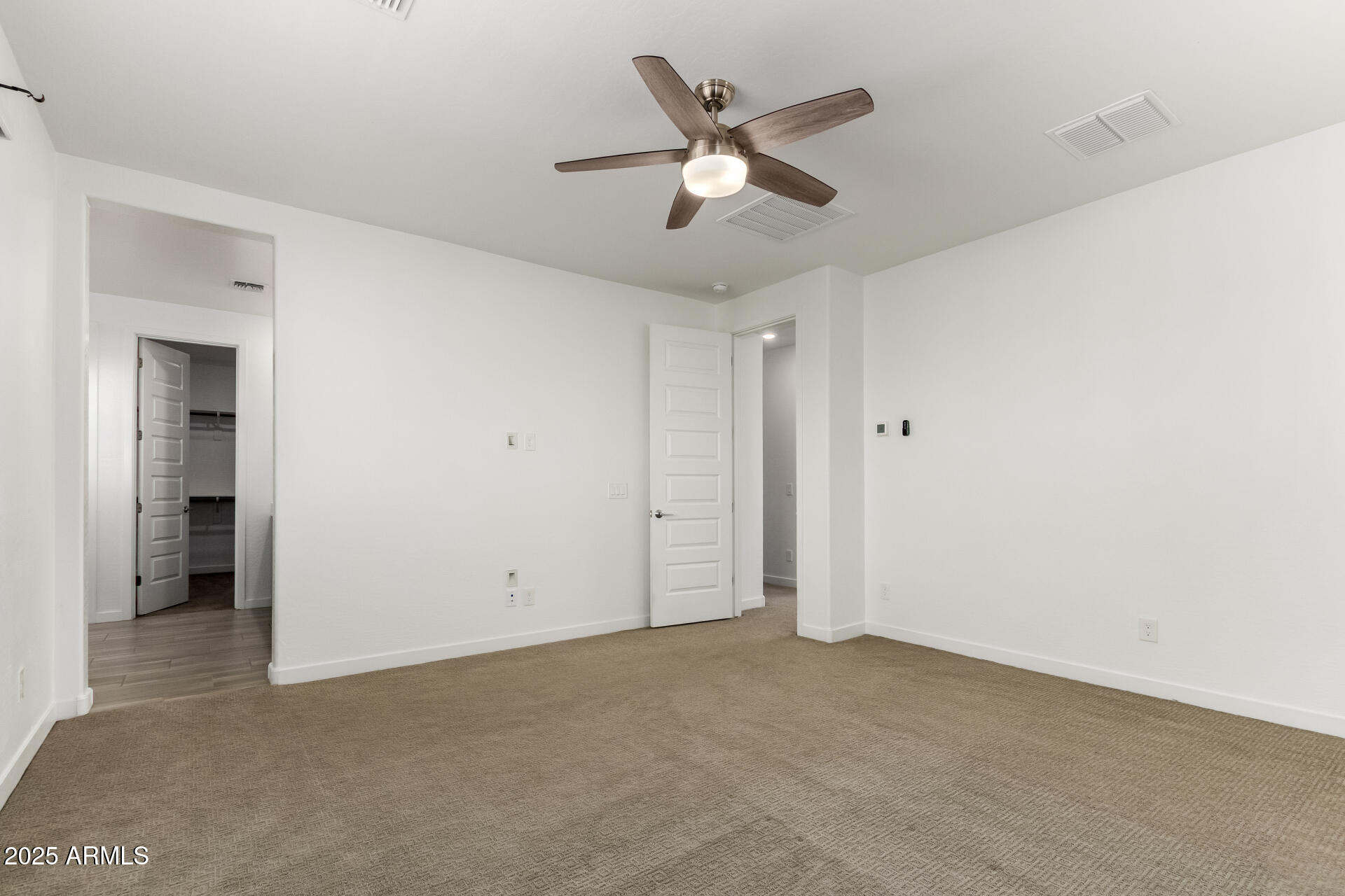 1156 East Weatherby Way Chandler, AZ 85286 - Photo 20 of 47 an empty room with closet and a ceiling fan