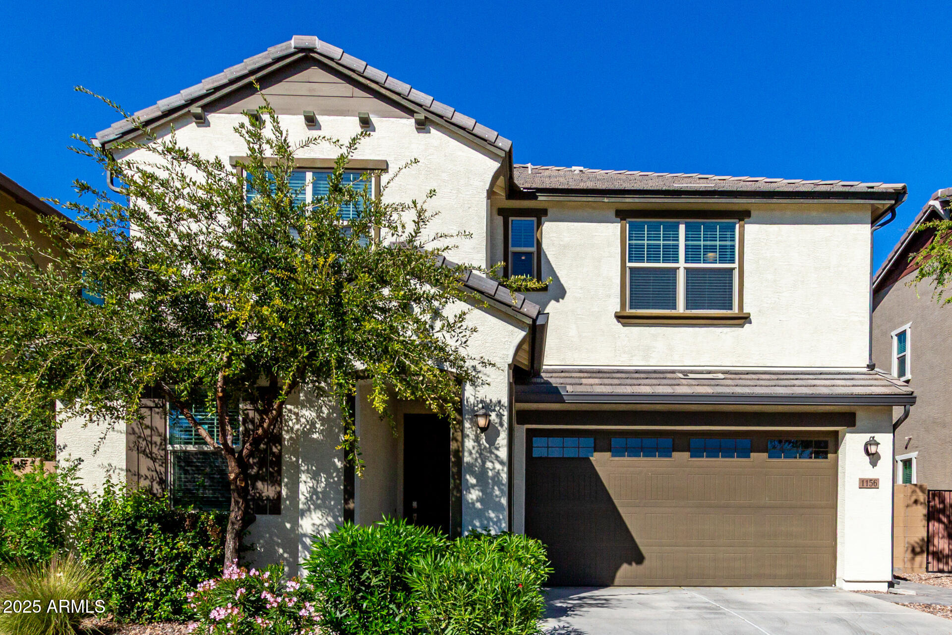 1156 East Weatherby Way Chandler, AZ 85286 - Photo 2 of 47 a front view of a house with garden