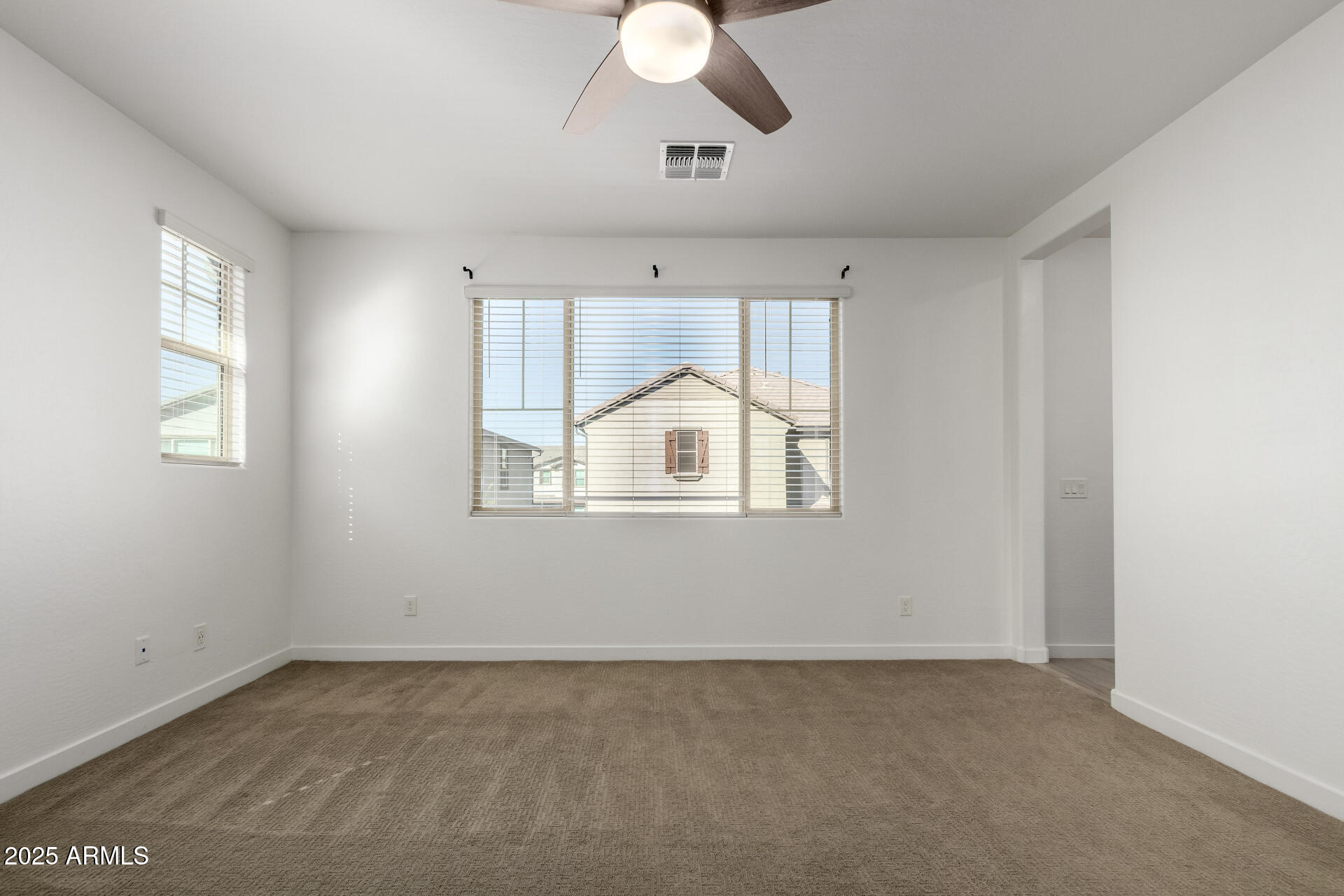 1156 East Weatherby Way Chandler, AZ 85286 - Photo 21 of 47 an empty room with chandelier fan