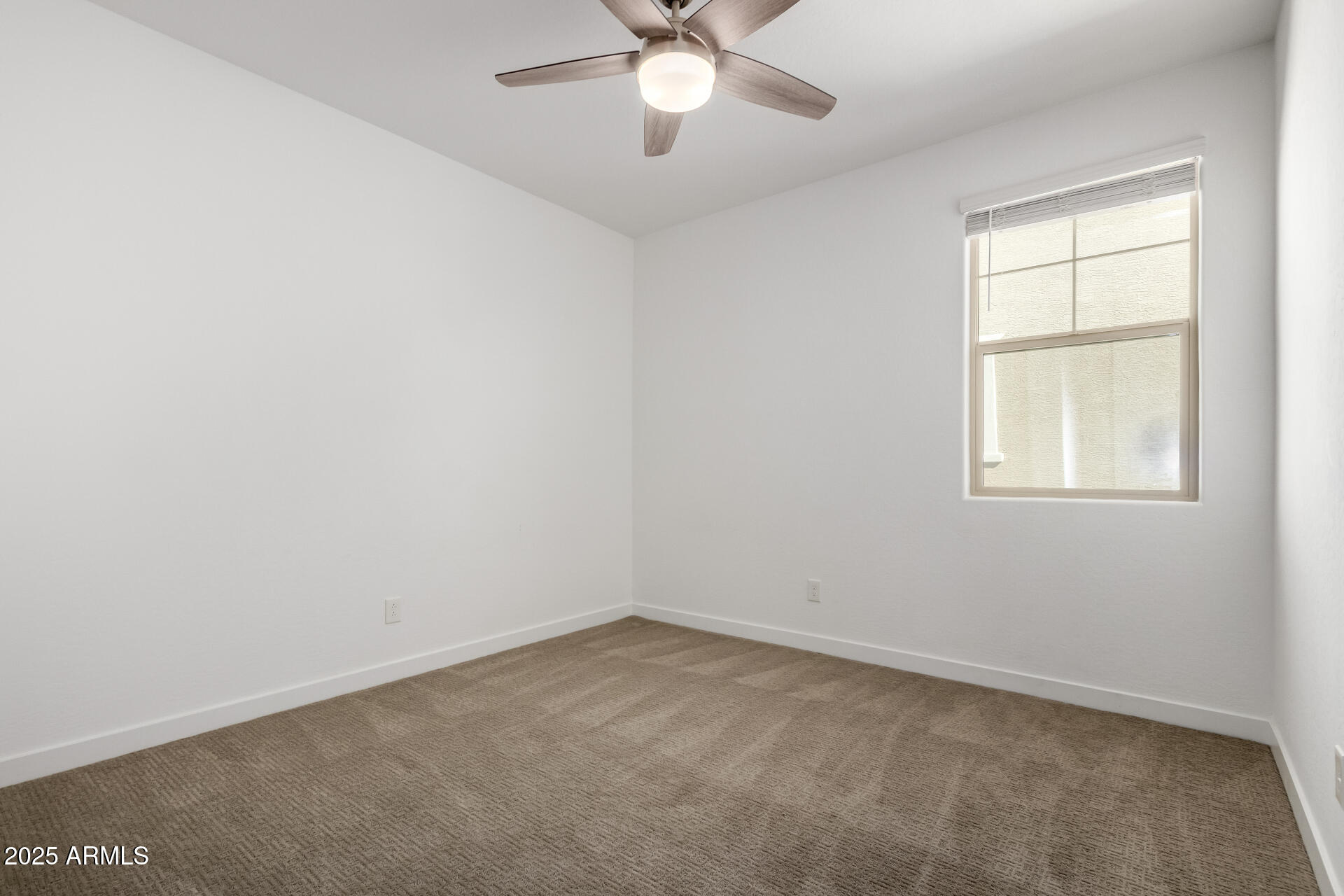 1156 East Weatherby Way Chandler, AZ 85286 - Photo 27 of 47 an empty room with a window