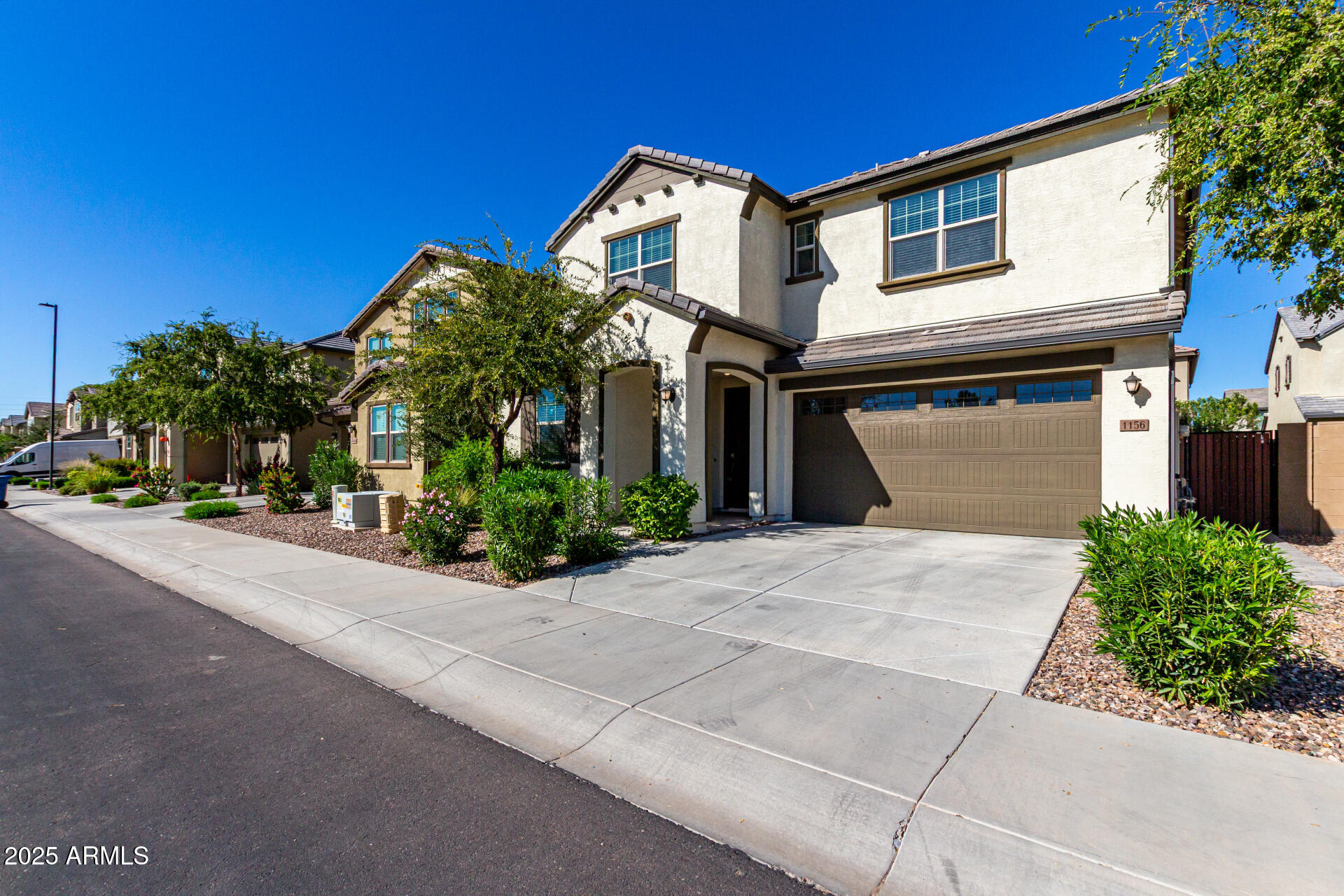 1156 East Weatherby Way Chandler, AZ 85286 - Photo 3 of 47 a front view of a house with a yard and garage