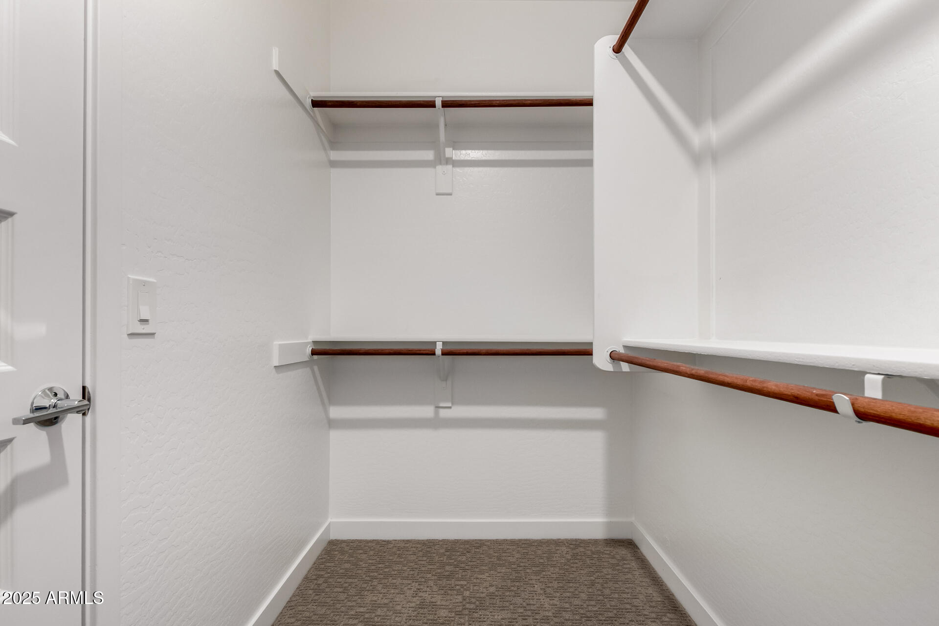 1156 East Weatherby Way Chandler, AZ 85286 - Photo 35 of 47 a view of walk in closet with empty racks