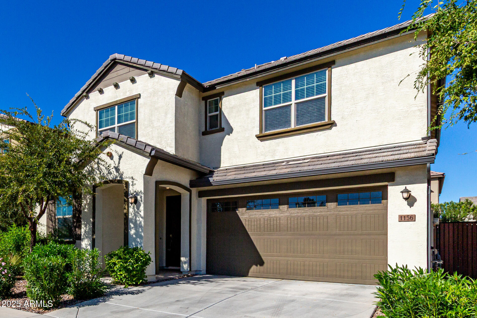 1156 East Weatherby Way Chandler, AZ 85286 - Photo 4 of 47 a front view of a house with a yard