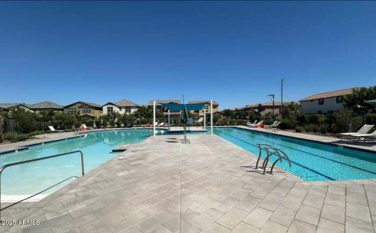 1156 East Weatherby Way Chandler, AZ 85286 - Photo 45 of 47 a swimming pool with outdoor seating and yard