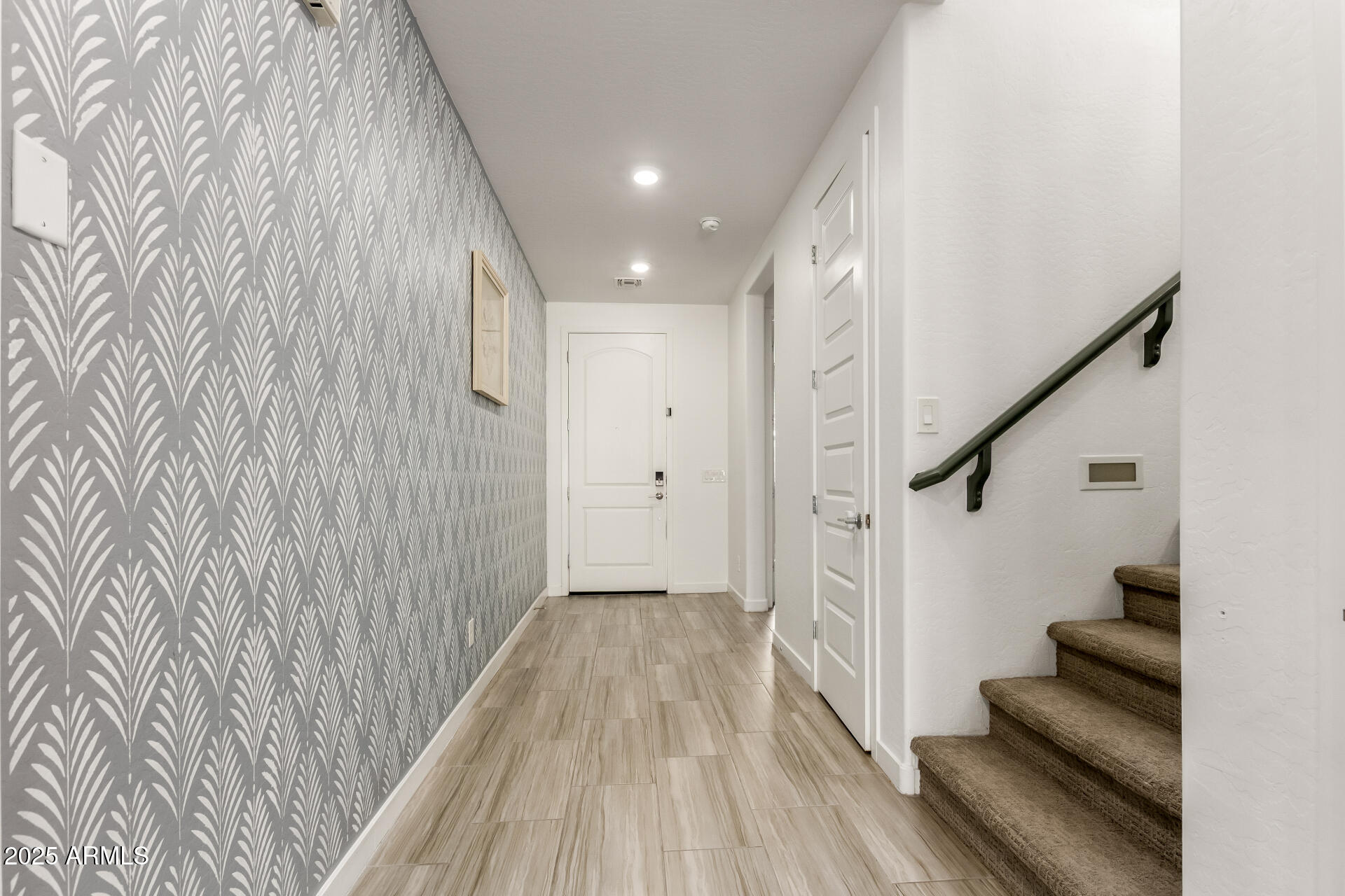 1156 East Weatherby Way Chandler, AZ 85286 - Photo 7 of 47 a view of a hallway with wooden floor and staircase