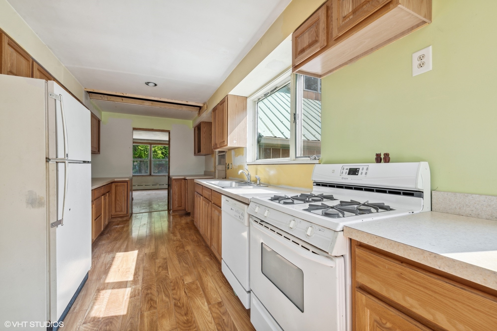 903 Lincoln Avenue Fox River Grove, IL 60021 - Photo 6 of 19 a kitchen with a stove a sink and a refrigerator