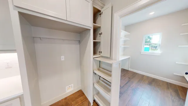 a view of kitchen and wooden floor