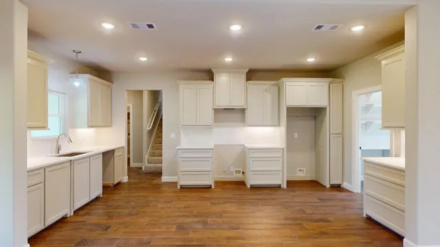a bathroom with a sink and a large mirror
