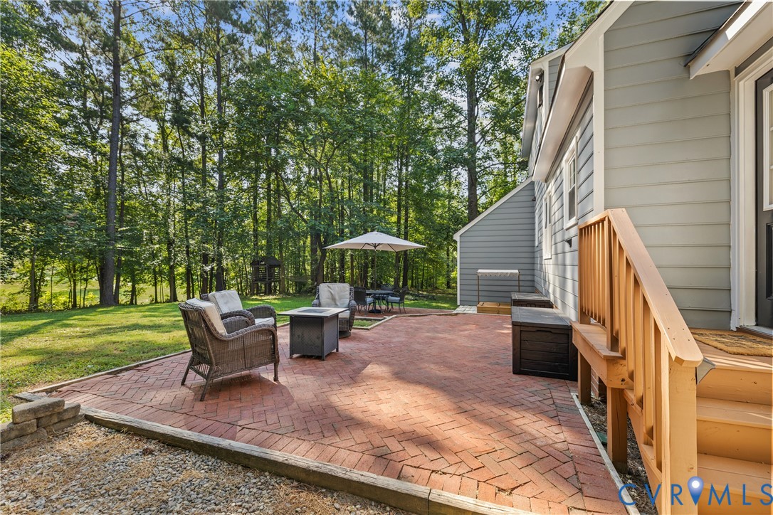 1144 Timber Trace Road Powhatan, VA 23139 - Photo 26 of 40 Expansive brick paver patio with a surrounding ret