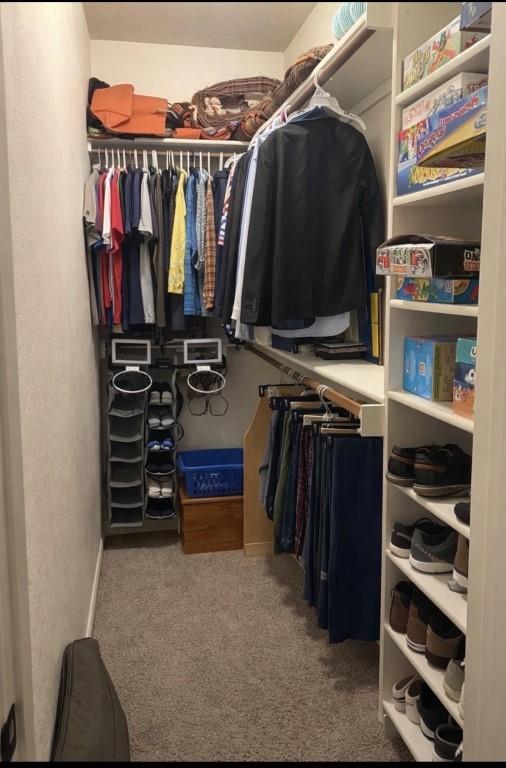 252 Tanner Street Stonewall, LA 71078 - Photo 23 of 34 a view of walk in closet with clothes and shoes