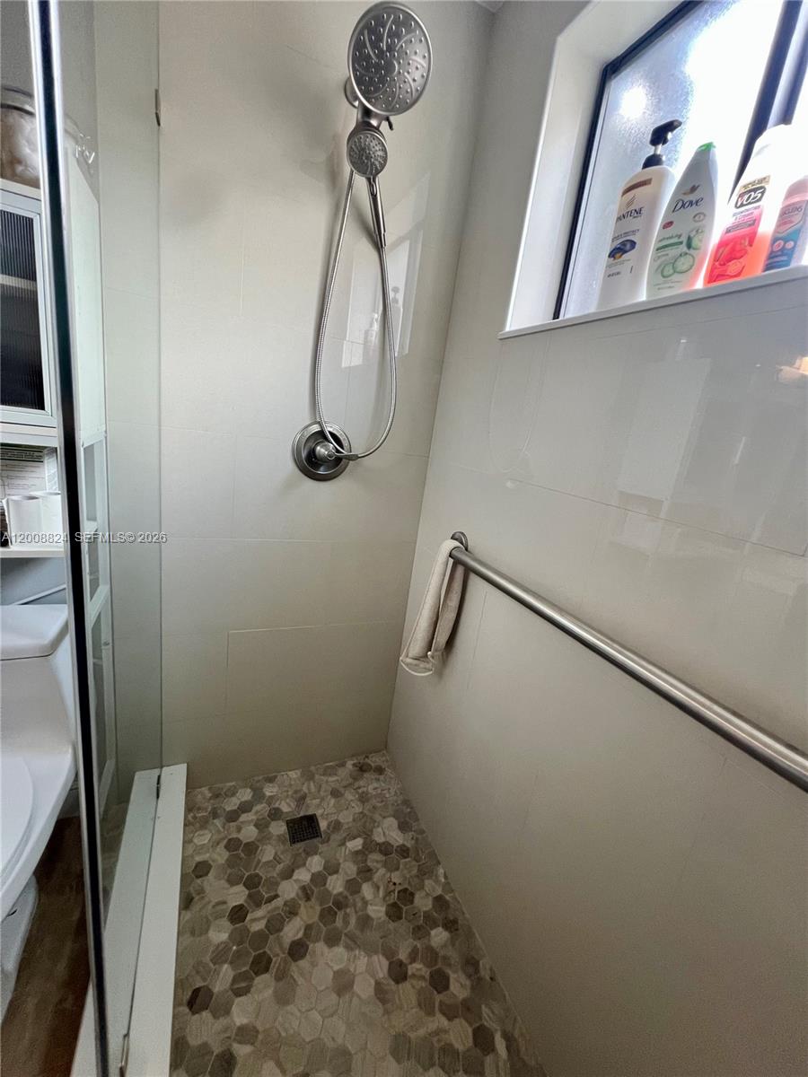 3610 Southwest 113th Place Miami, FL 33165 - Photo 13 of 49 a bathroom with a shower